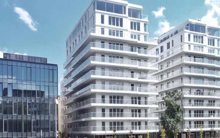 A modern residential building with glazed verandas on every floor