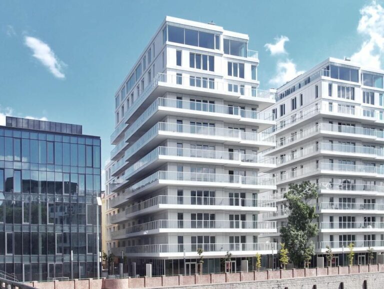 A modern residential place with veranda for every floor, enclosed in metal railings and glass framing